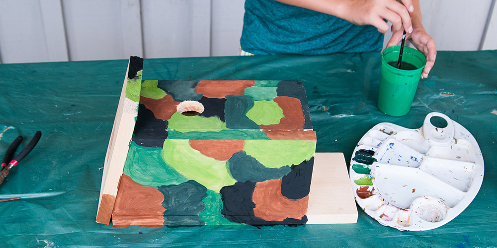 Millcreek Gardens-Salt Lake City-Utah-Engaging Your Kids with Nature in Utah-painting bird house Millcreek Gardens-Salt Lake City-Utah-Engaging Your Kids with Nature in Utah-painting bird house